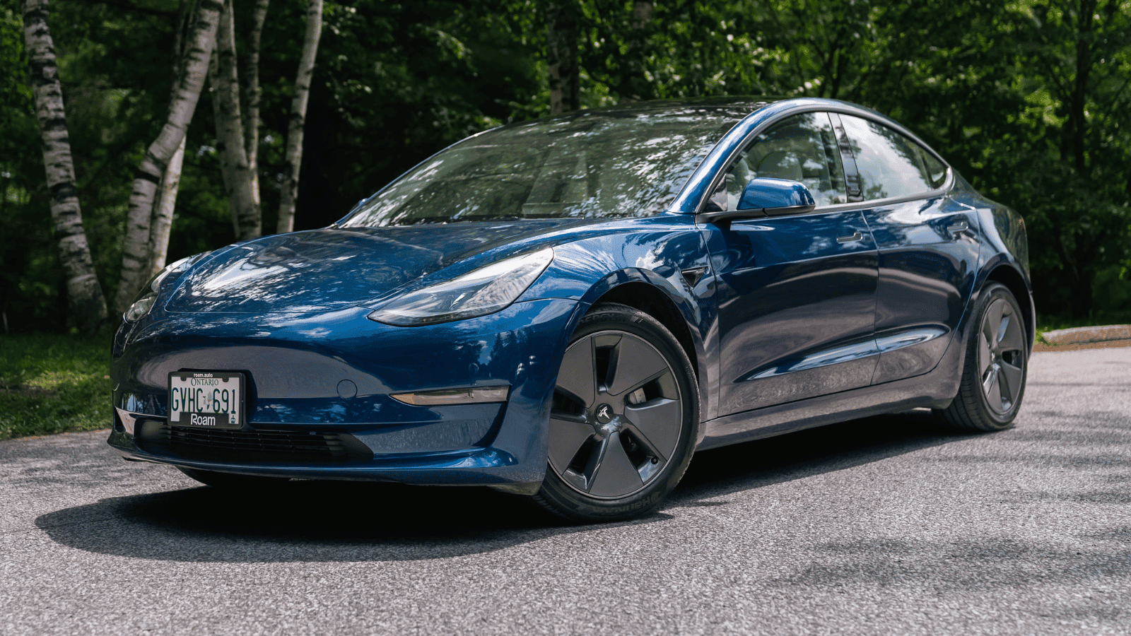 Blue Tesla sedan outdoors